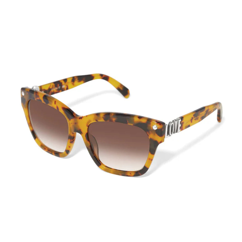 Tortoiseshell sunglasses with brown gradient lenses on a white background