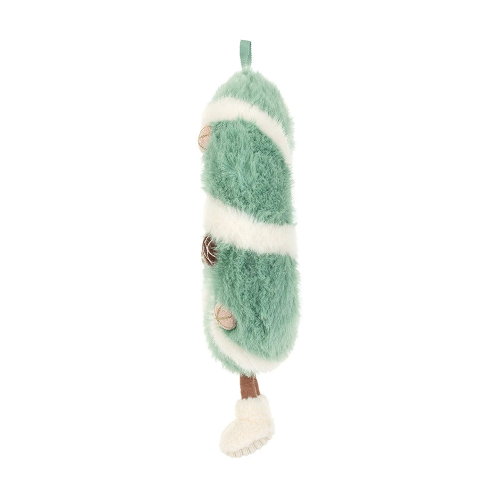 The side of a green and white striped wreath-shaped plush toy with acorn and pinecone details, a hanging loop, and small legs with white feet, shown on a plain white background.