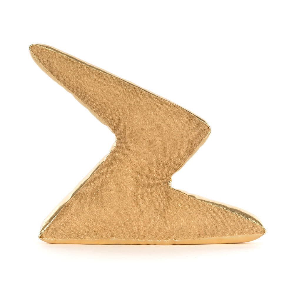 A photo of the back of a gold lightning bolt-shaped figurine plush toy with a smiling face and gold legs on a white background.