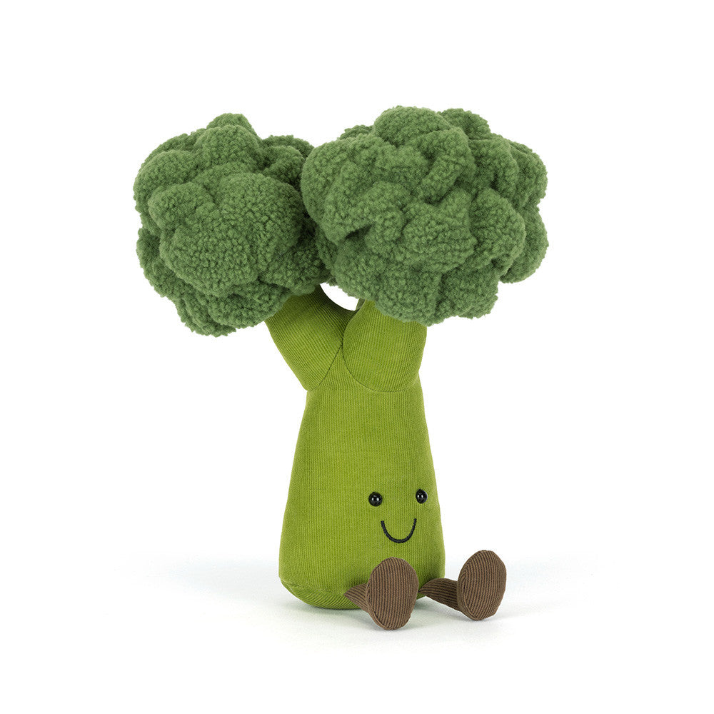 A  angled facing photo of a plush toy shaped like green broccoli on a white background