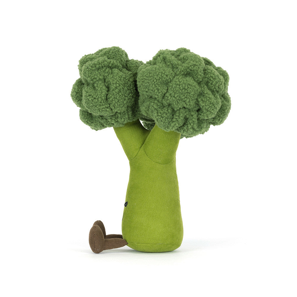 A left side facing photo of an plush toy shaped like green broccoli on a white background