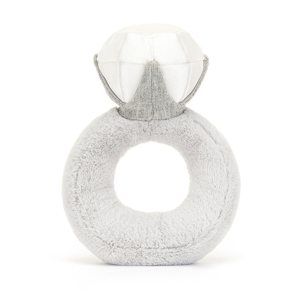 A photo of the back of a  grey and white plush toy shaped like a diamond ring with a smiling face on a white background