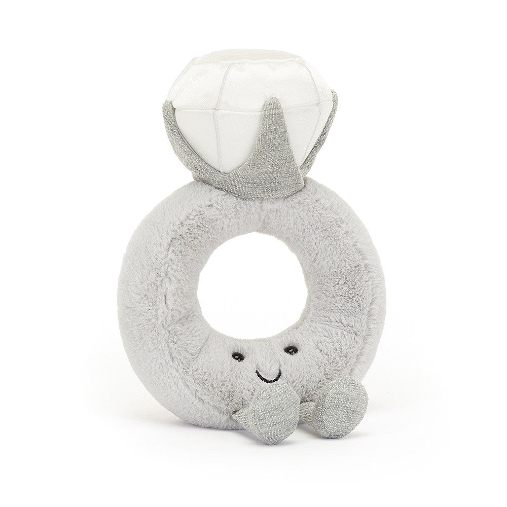 A grey and white plush toy shaped like a diamond ring with a smiling face on a white background