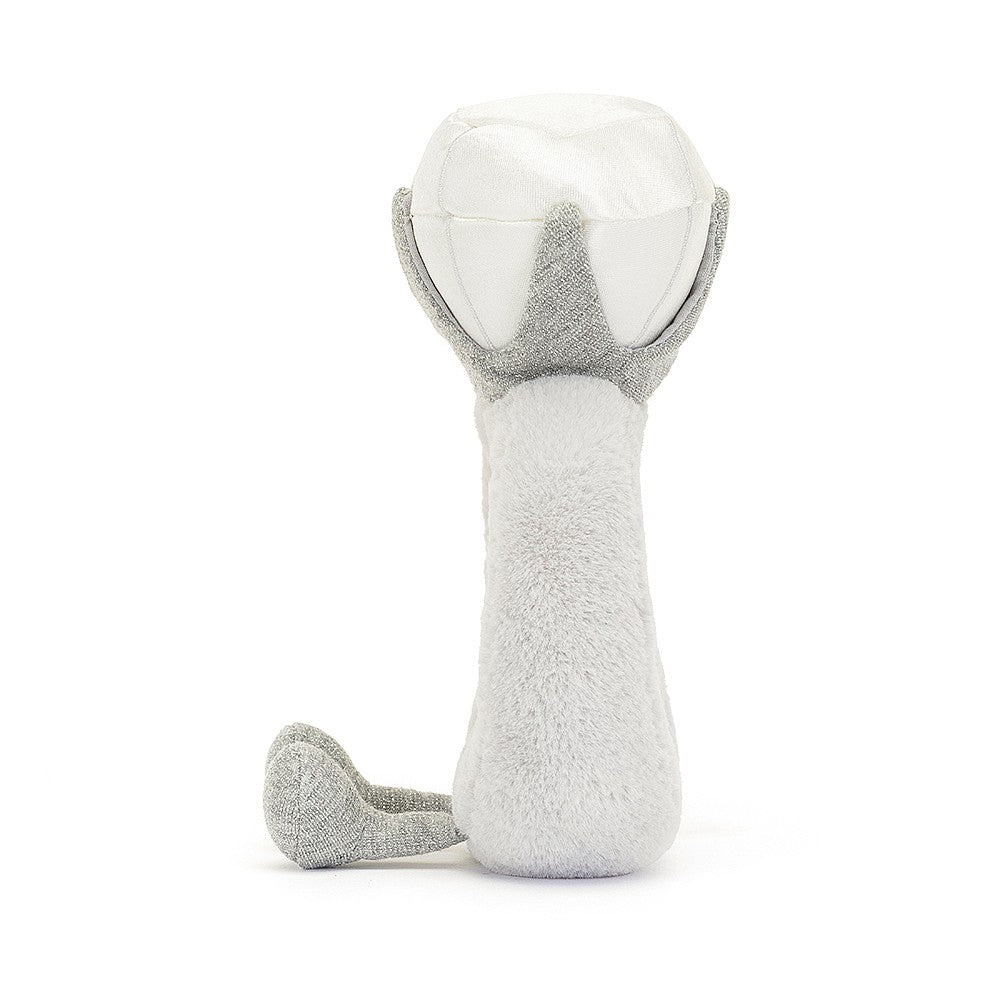 A side photo of a  grey and white plush toy shaped like a diamond ring with a smiling face on a white background
