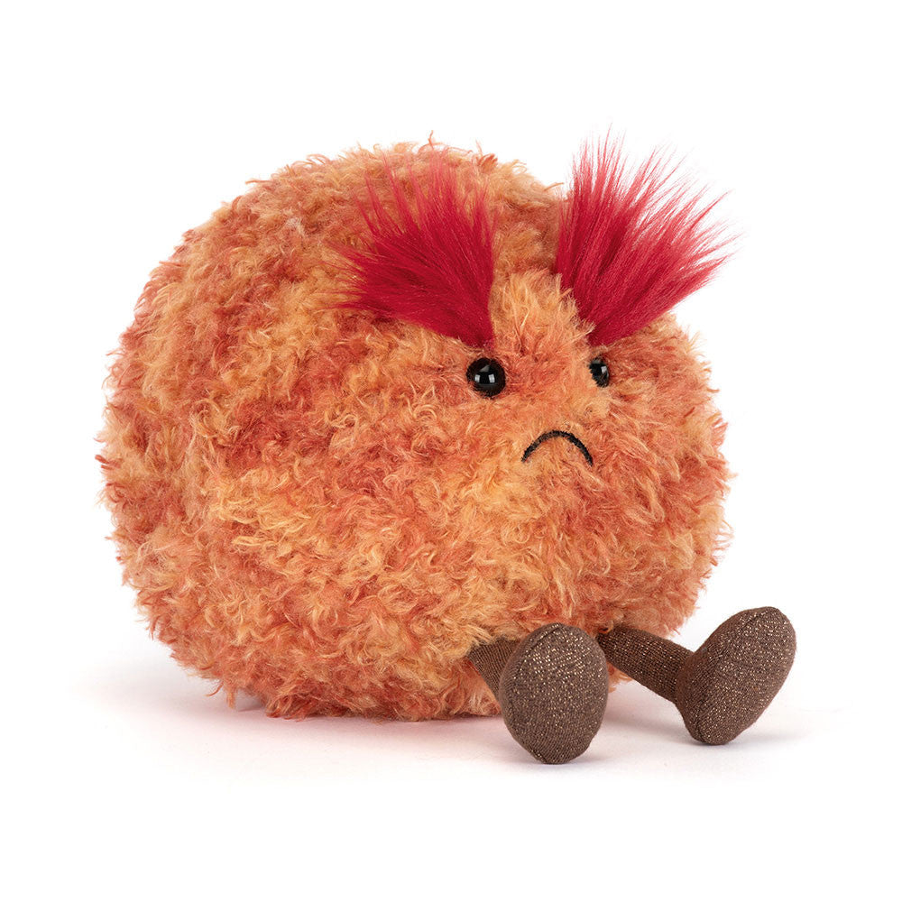 An angled side photo of jellycat amuseables planet marsplush toy with red hair and a sad expression on a white background