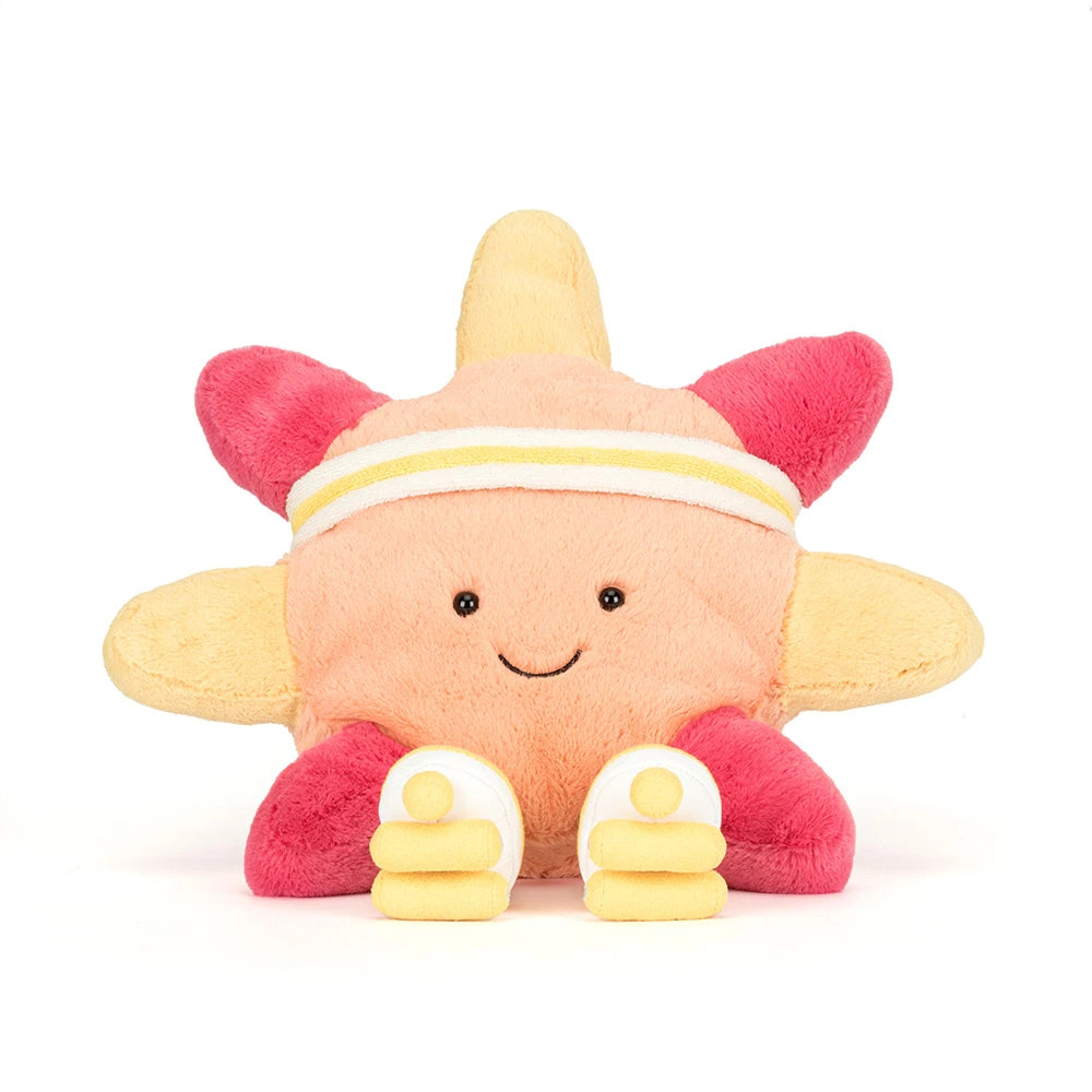 A sun themed plush toy, with roller skates in orange, pink and  yellow, with a white and yellow headband with yellow and white skates and brown legs on a white background