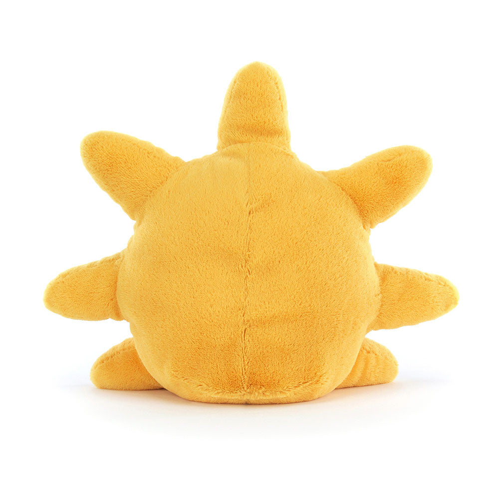 A photo of the back of a yellow plush sun toy with a smiling face and brown legs on a white background.