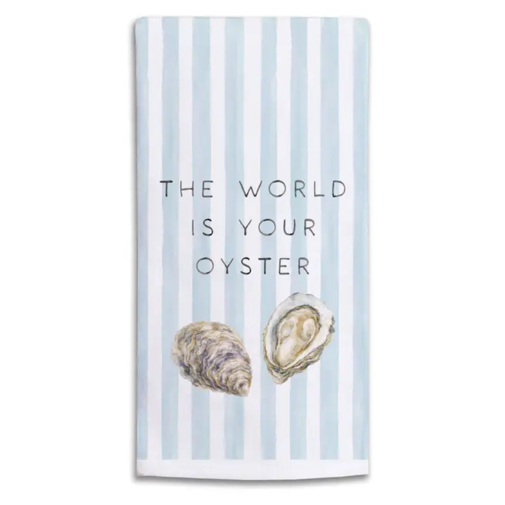 A "the world is your oyster" kitchen towel on a white background. 