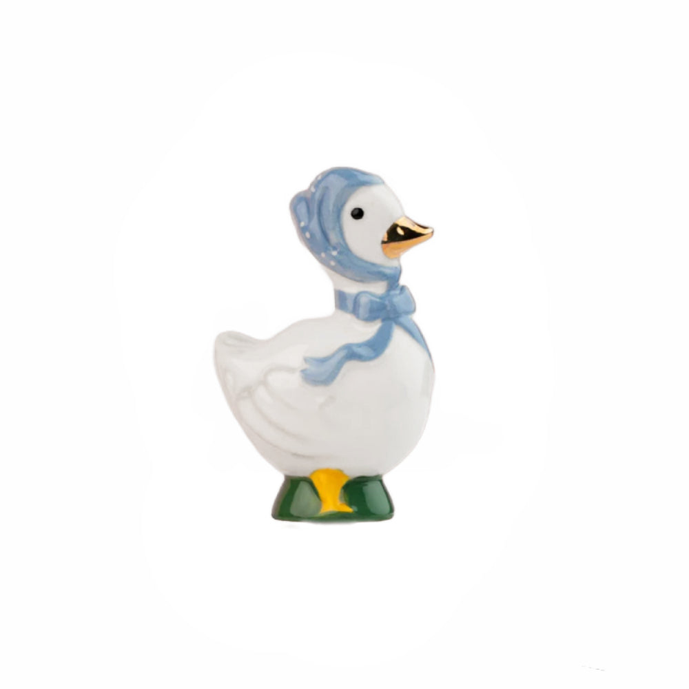 Decorative duck figurine with a blue bonnet on a white background