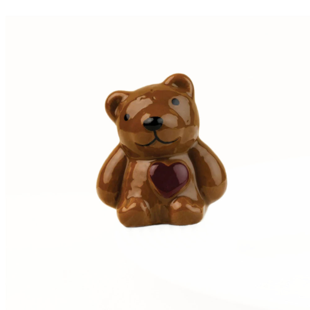 Brown bear figurine mini with a red heart on a white background.