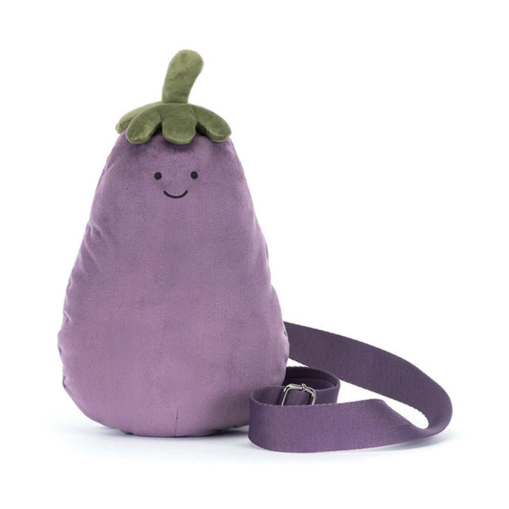 A purple eggplant-shaped shoulder bag with a green top and a smiling face, shown on a clean white background with its strap coiled in front.