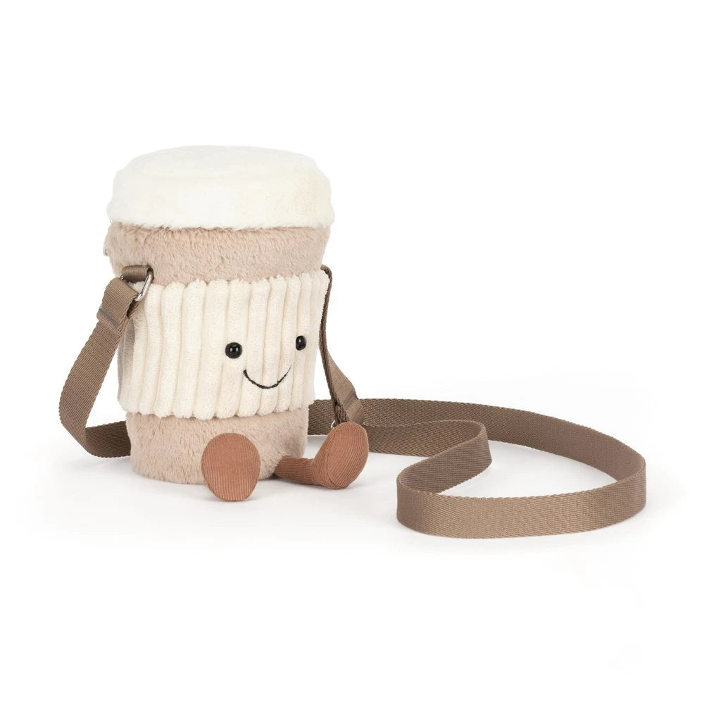 Children's toy resembling a cup with a face on a white background