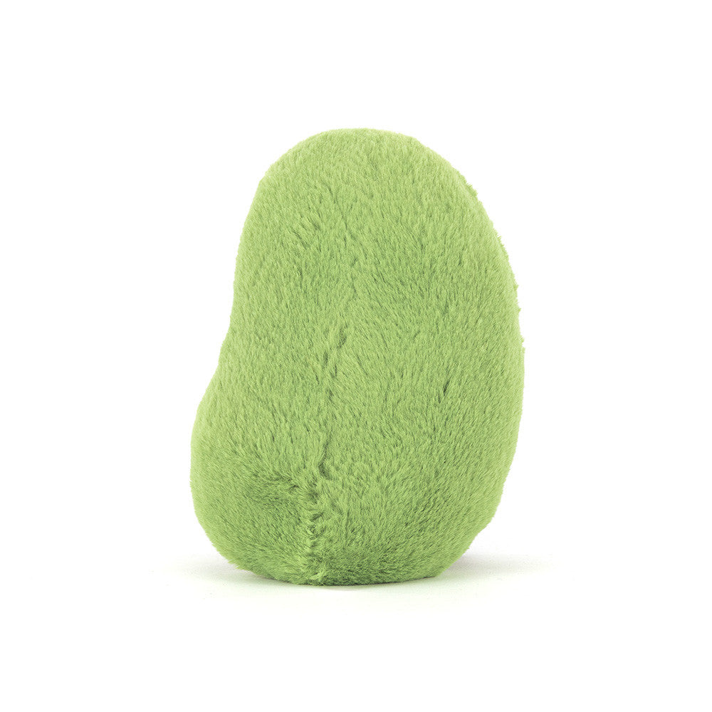 A photo of the back of a green Soyella Bean plush toy with a smiling face and brown legs on a white background.