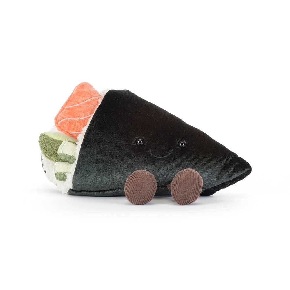 Plush toy resembling a sushi roll with  rice, pink salmon, and green wasabi with a smiling face and brown legs on a white background.