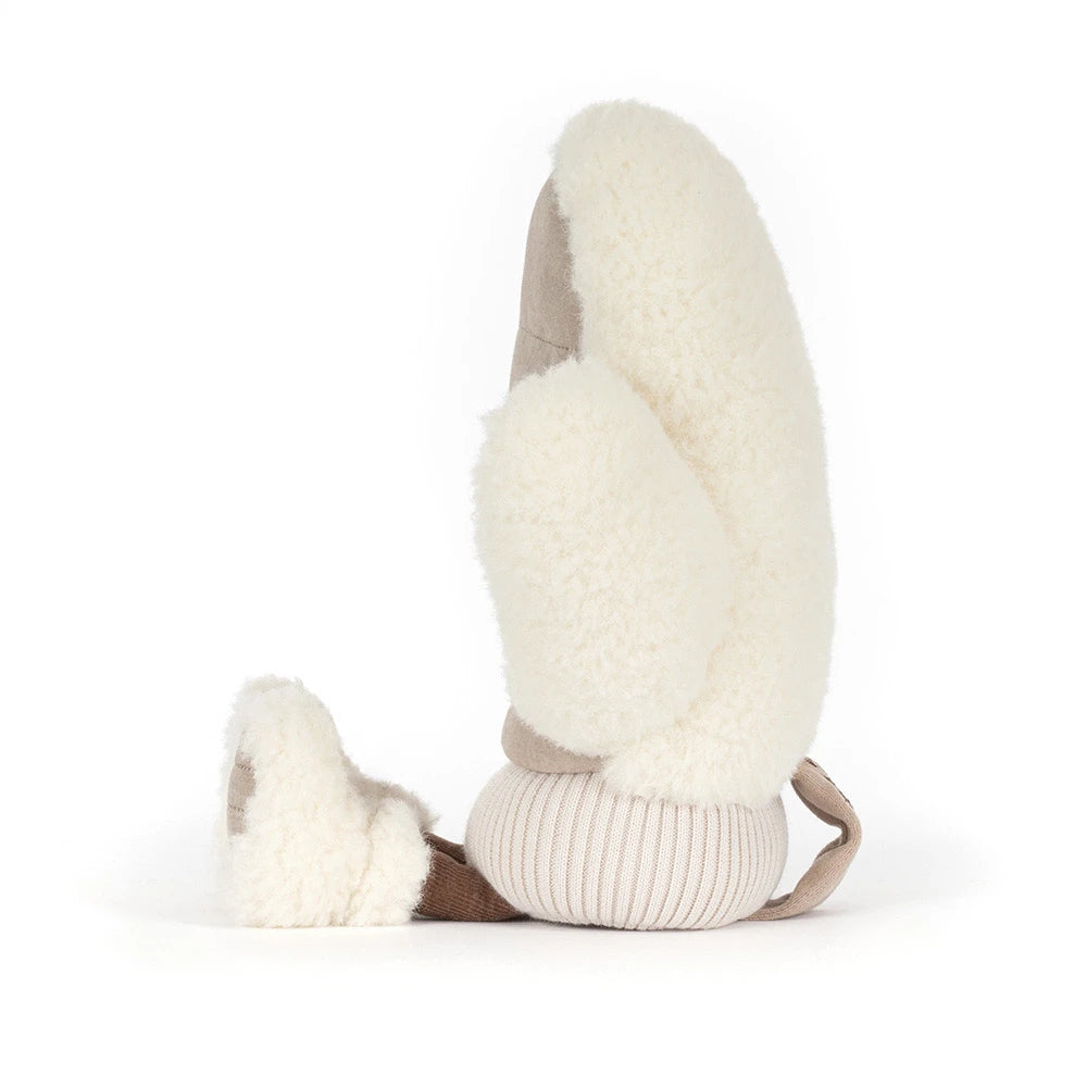 A plush sheepskin mitten in cream and beige, shown from a side profile on a white background.