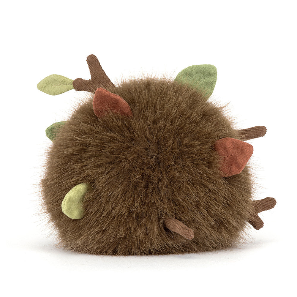 A  photo of the back of a Mulshi Woodland Floor plush toy with a smiling face and brown legs on a white background.