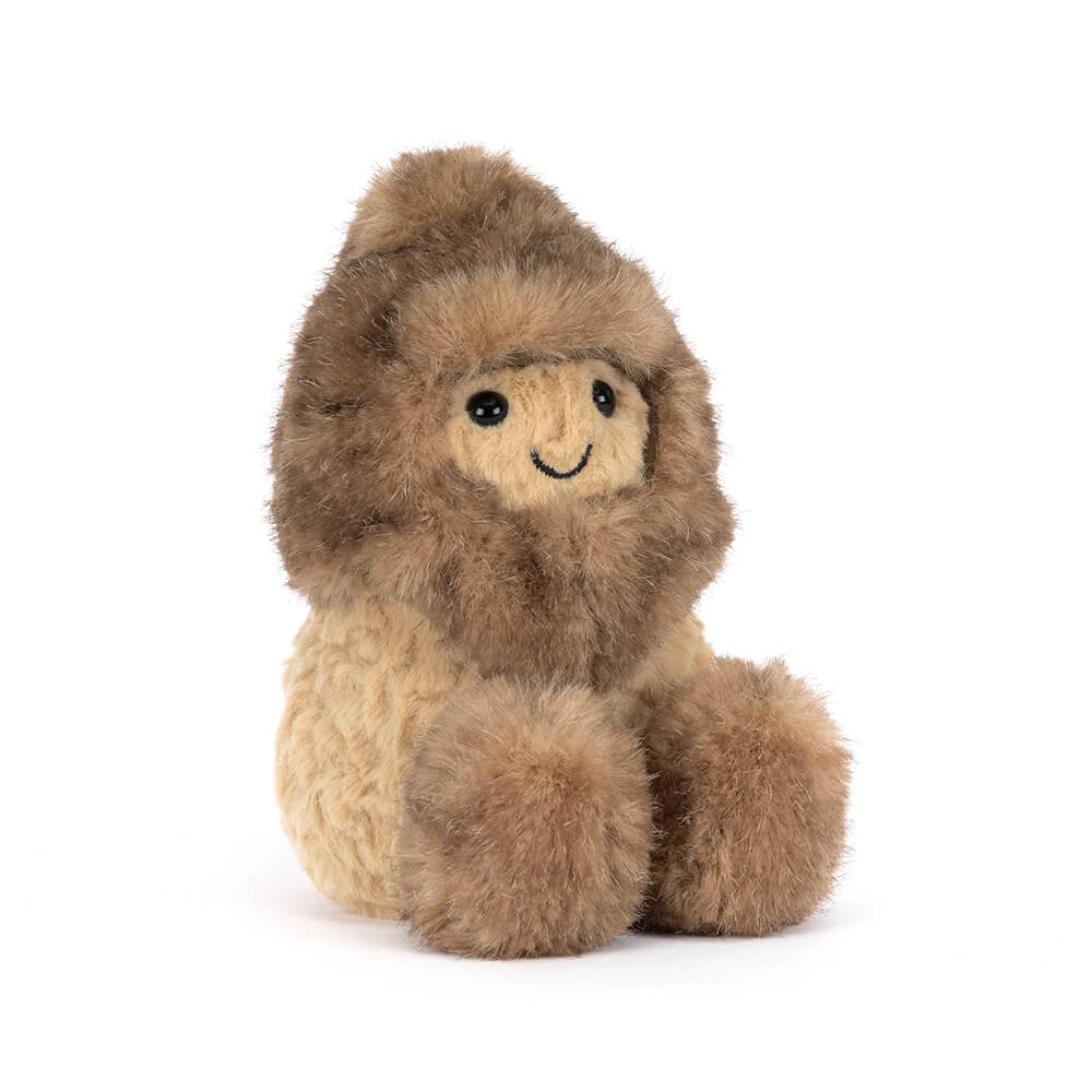 Side angled photo of a brown Peanut Yeti plush toy with a smiling face on a white background.