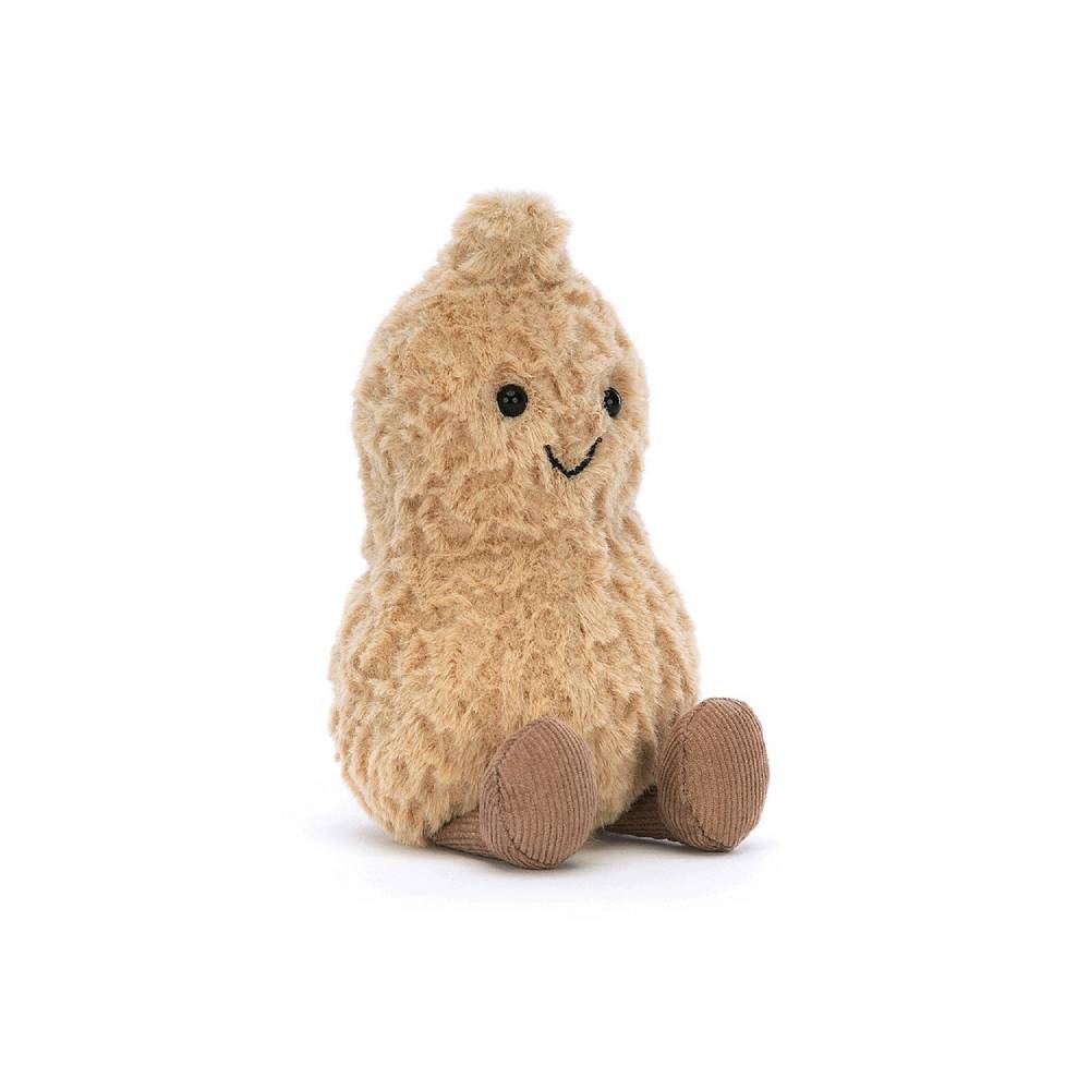 A angled photo of plush toy resembling a beige Peanut  with a smiling face on a white background.