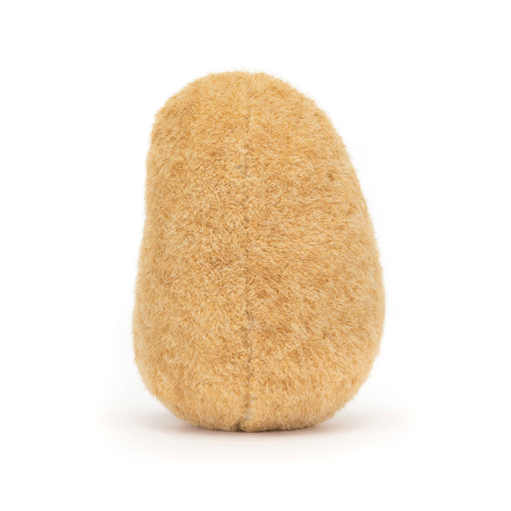 A photo of the back of  a plush toy shaped like a potato with a smiling face and brown legs and feet on a white background.