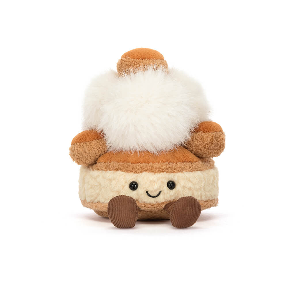 A front photo of a push toy resembling a marshmallow with brown and white colors on a white background.