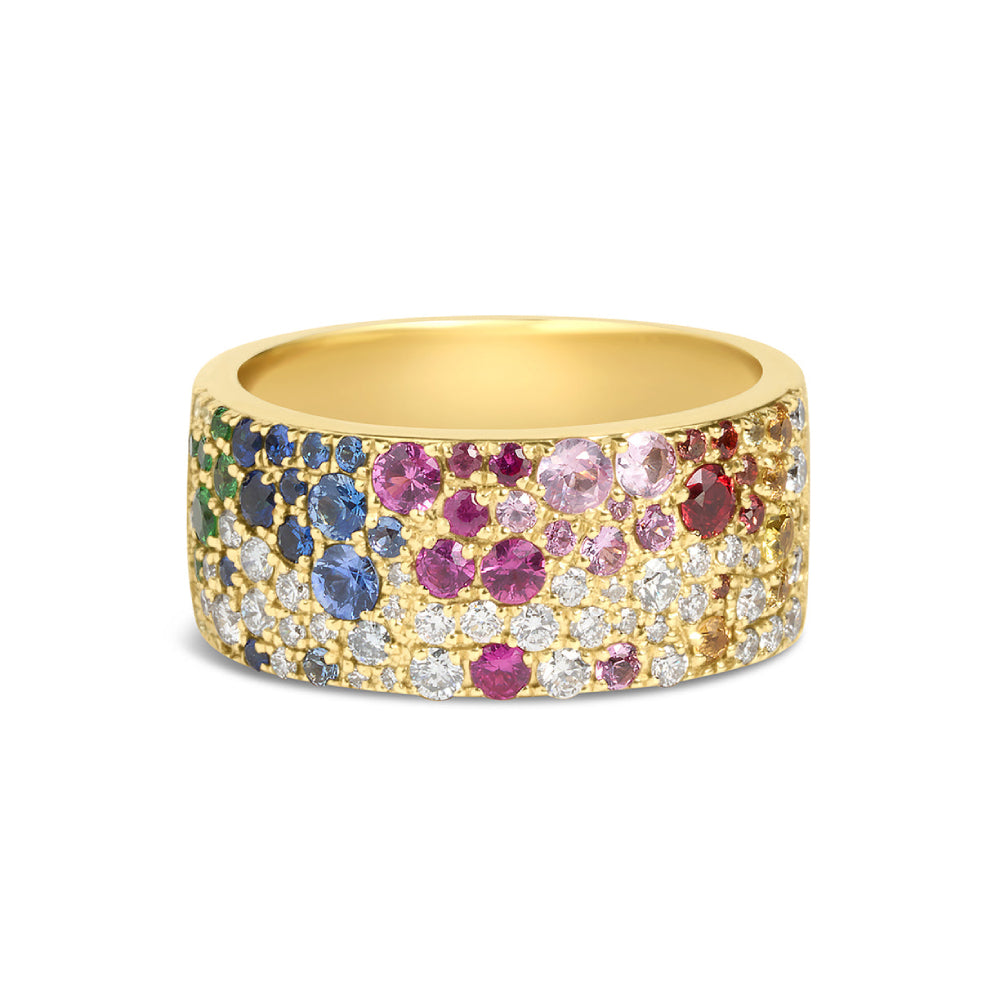 Gold ring with multicolored gemstones on a white background
