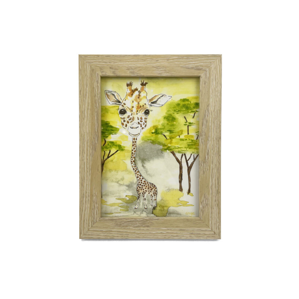 Framed artwork of a giraffe in a natural setting with trees and grass, on a white backround.