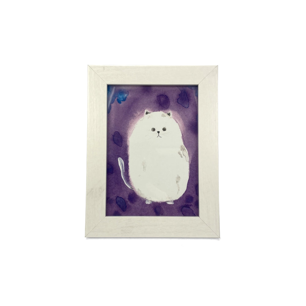 Framed artwork of a white cat on a purple background on a white backround. 