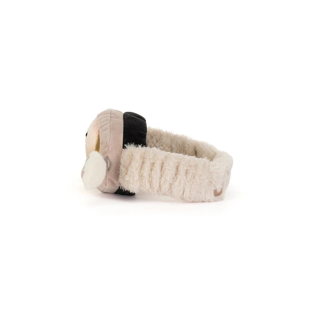 The of a plush novelty ski goggles with a shiny gold reflective lens, featuring a cute smiling face and fluffy beige faux-fur trim with glove-like extensions on the sides.