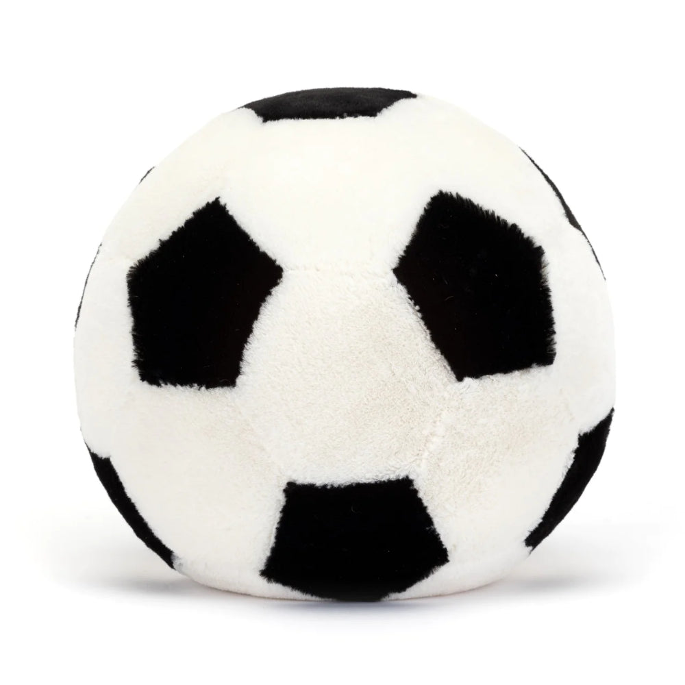 A photo of the back of a  plush toy resembling a white and black soccer ball, featuring a friendly face and legs on a white backround.