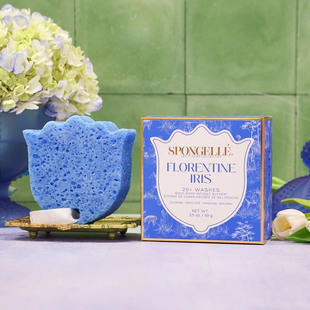 Blue sponge and Florentine Iris soap packaging on a green and purple background