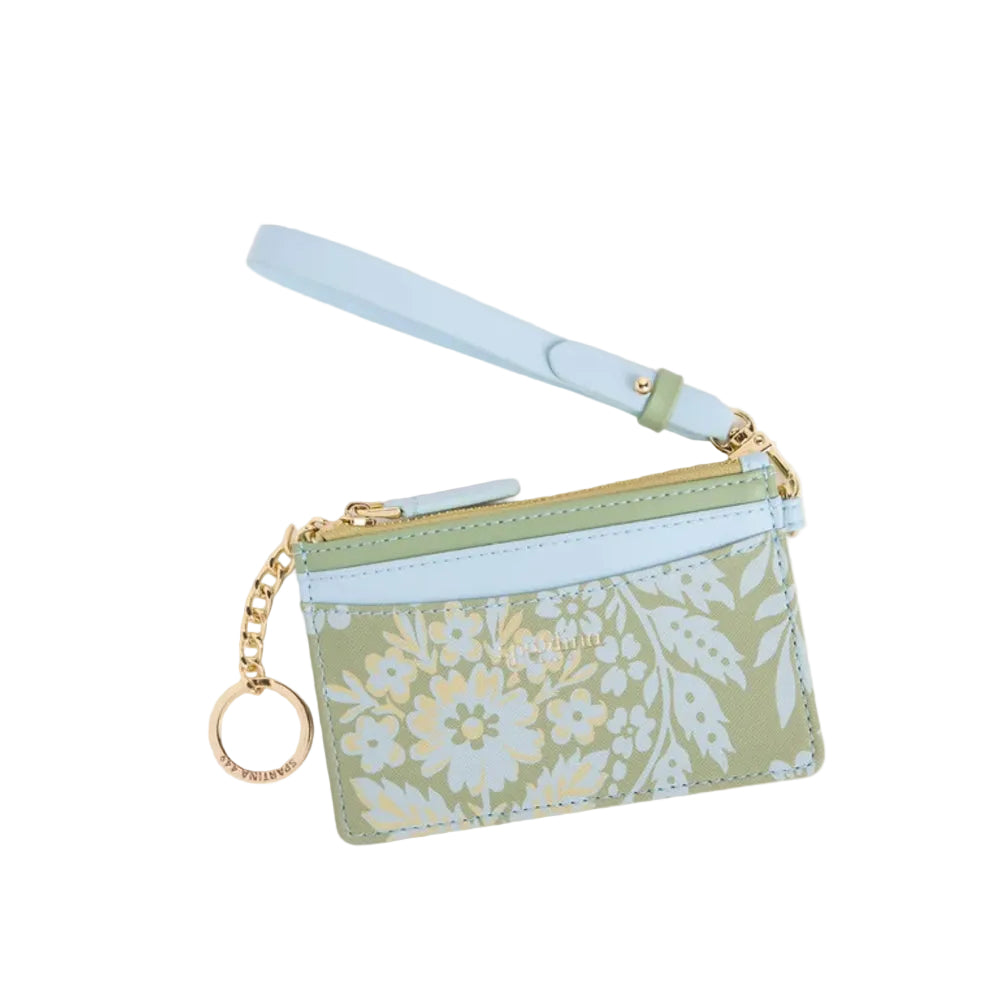 A small floral card holder pouch with a wrist strap, featuring a sage green and light blue floral pattern with gold-tone hardware and a key ring charm.