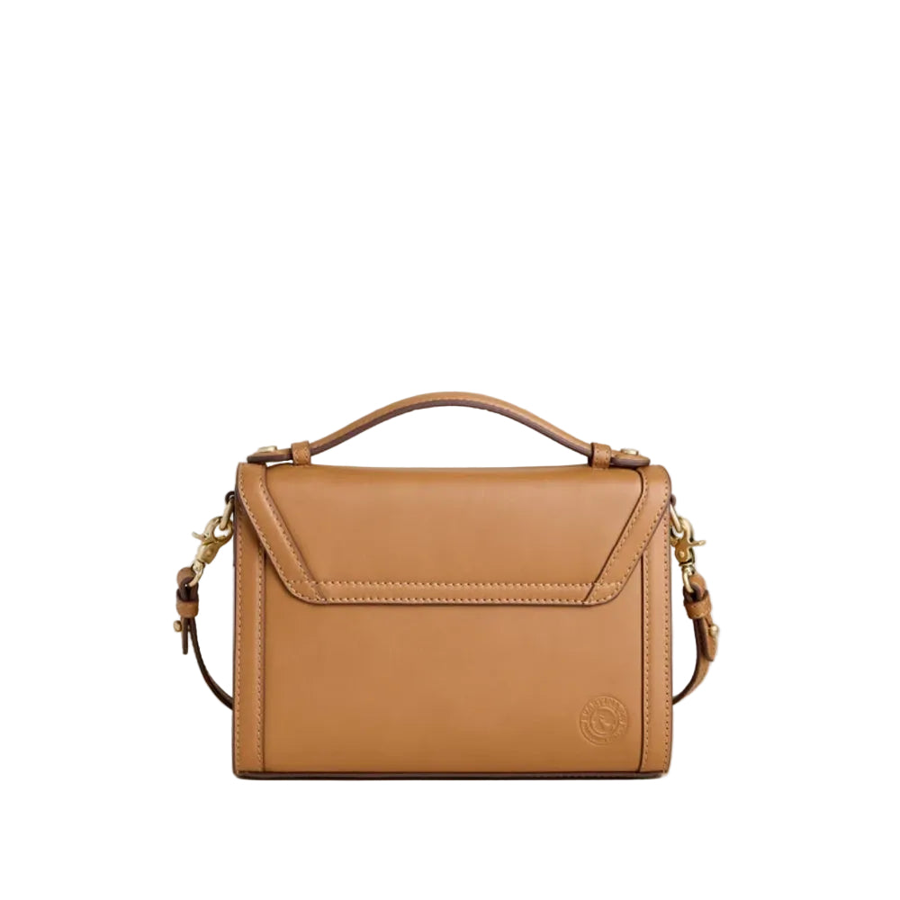 A tan leather handbag with a top handle, a front flap pocket, and a detachable shoulder strap, photographed against a plain white background.