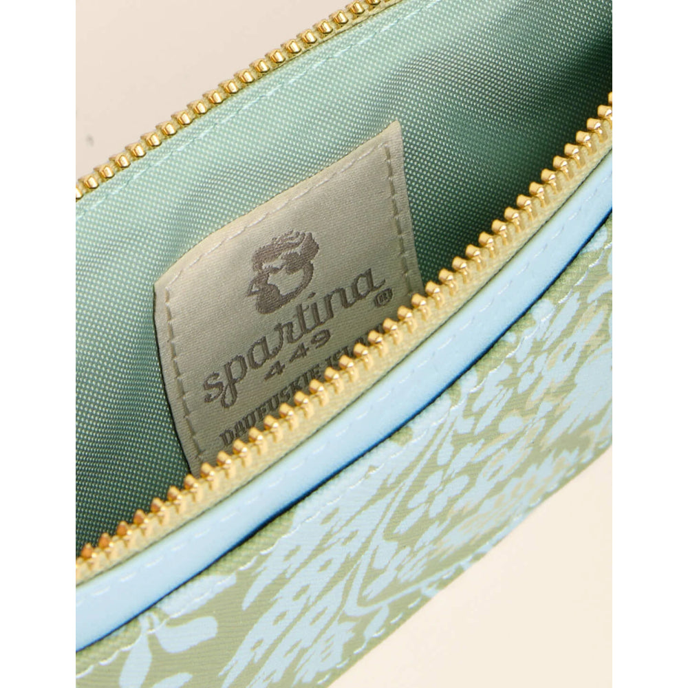 Close-up of a Sparatina 249 pouch showing the interior with sage green fabric lining, a gold zipper, and a light blue and white patterned exterior.