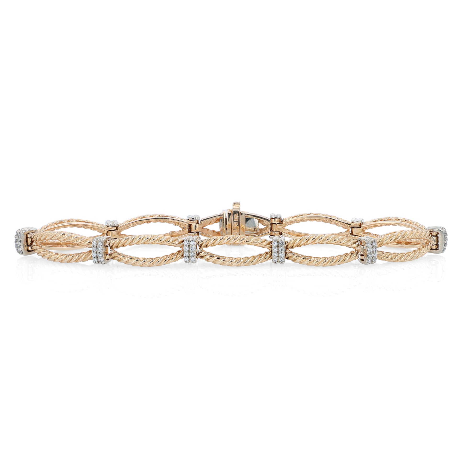 Gold bracelet with interlocking rope design links and alternating white gold diamond station accents on a white background