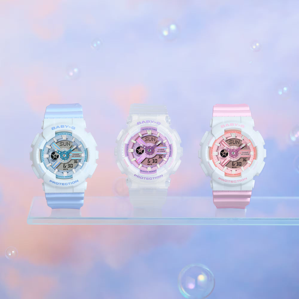 Three babygloss watches on a stand with a soft, blurred background