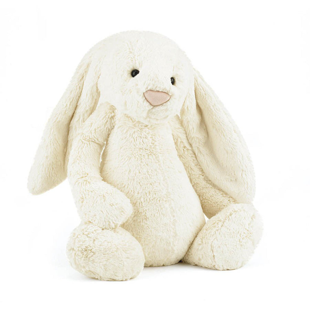 Really big sized cream-colored plush bunny toy on a white background.