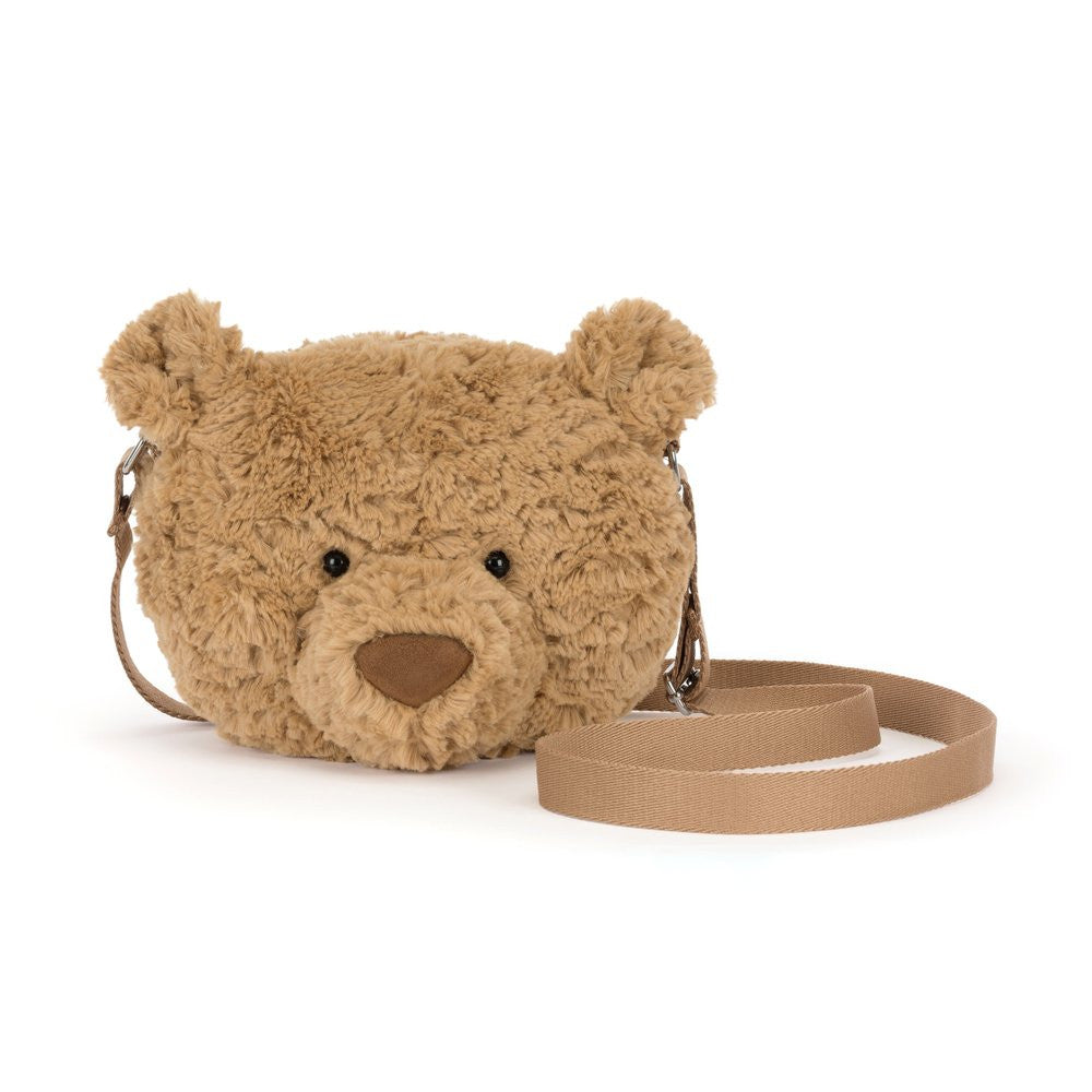 Teddy bear-shaped bag with a strap on a white background