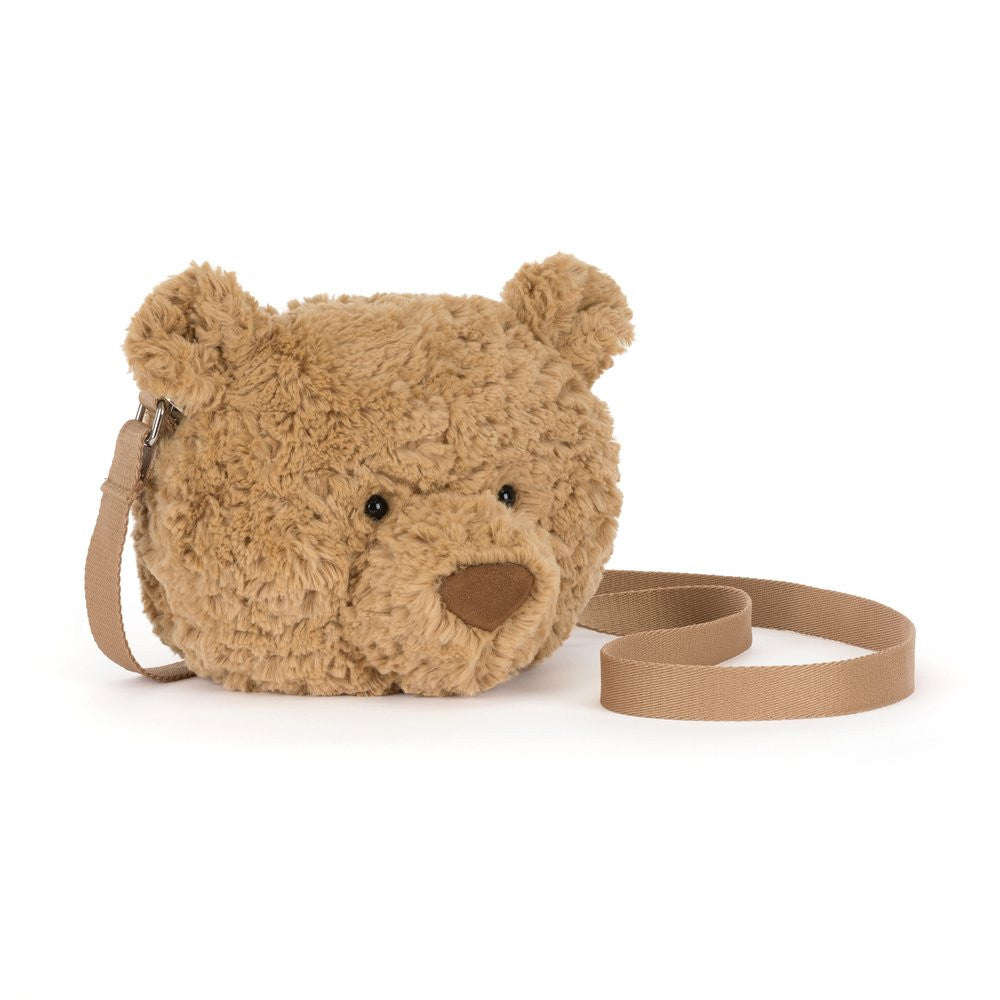 Teddy bear-shaped bag with a strap on a white background