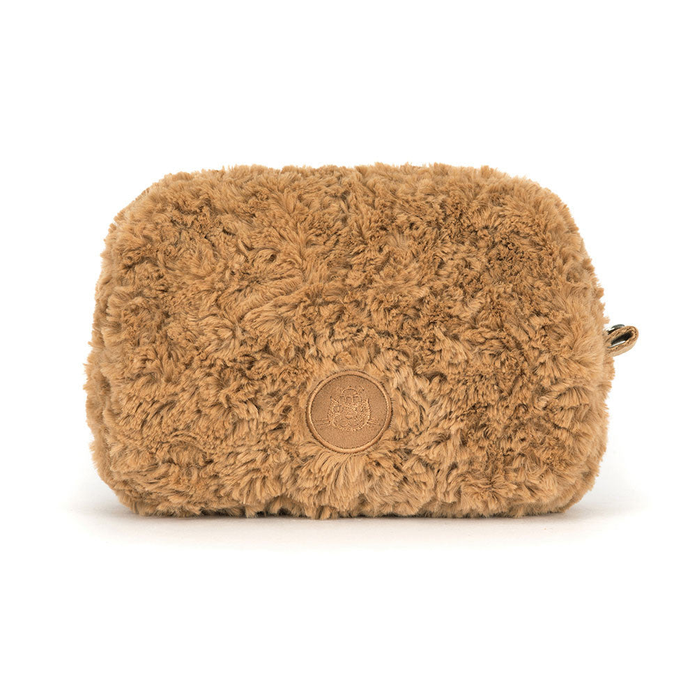 The back of a brown teddy bear-shaped with a brand logo on a white background.