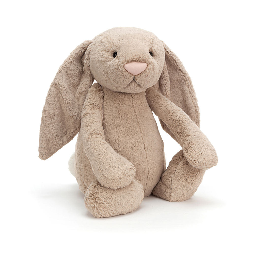A Really big size  beige plush toy in the shape of a bunny with long floppy ears, a small pink nose, and a soft fur texture on a white backround 