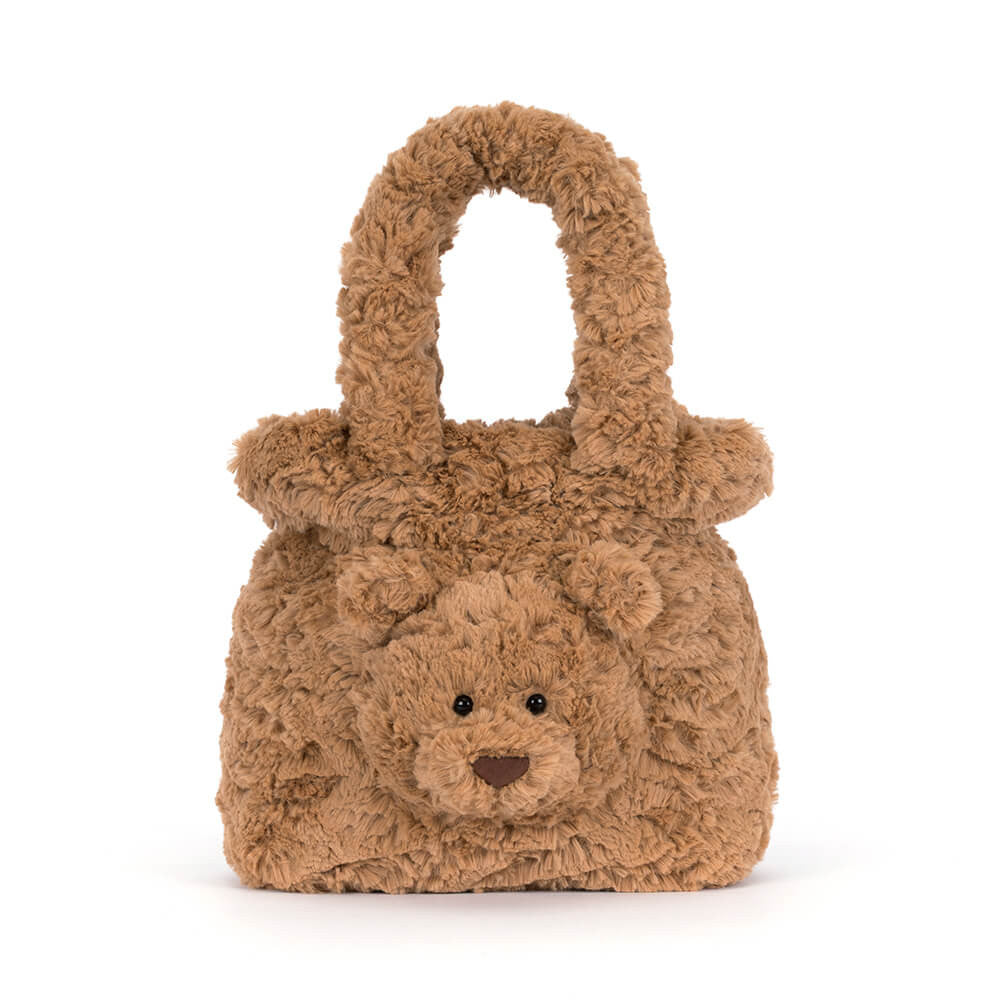A brown teddy bear-shaped handbag made of curly, textured faux fur, featuring a small embroidered face and a top handle, shown on a plain white background.