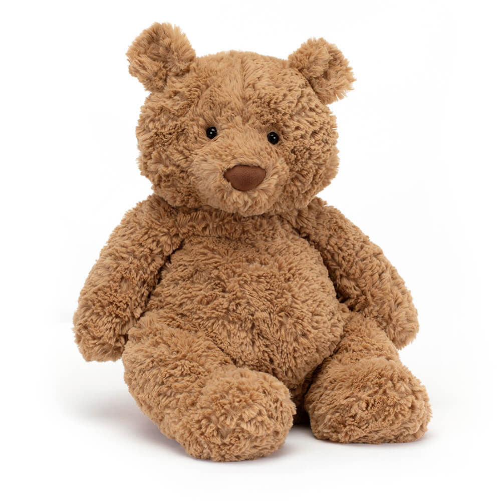 A large size beige teddy bear with a sitting upright on a white backround. 