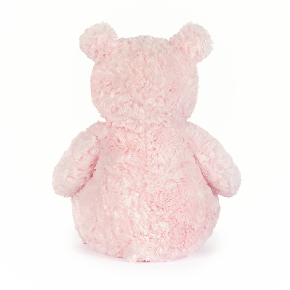 The back of a pink teddy bear plush toy on a white background.