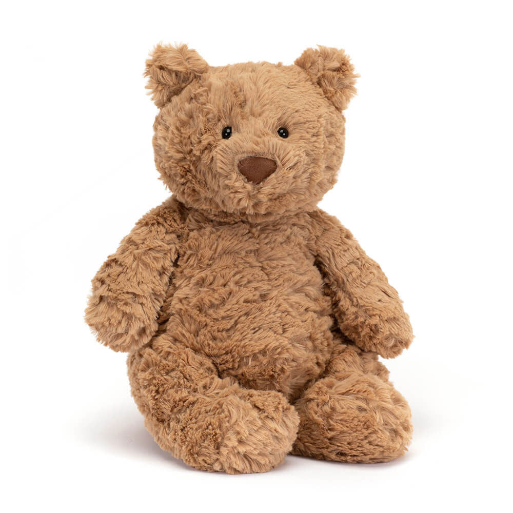 A huge size beige teddy bear sitting upright on a white backround.