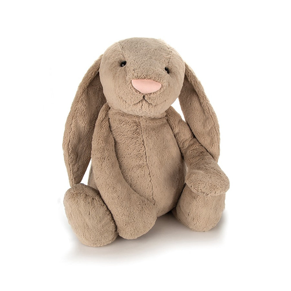 A huge size  beige plush toy in the shape of a bunny with long floppy ears, a small pink nose, and a soft fur texture on a white backround 