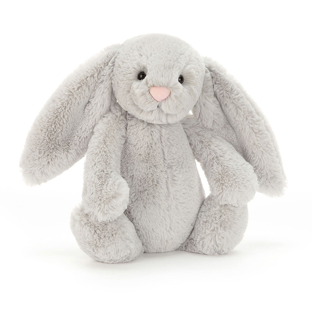 A silver grey bunny with long ears and a soft belly, sitting upright.