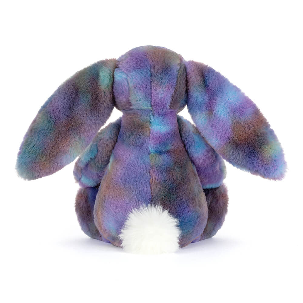 Back side facing photo of a purple multicolored plush bunny  on a white background.