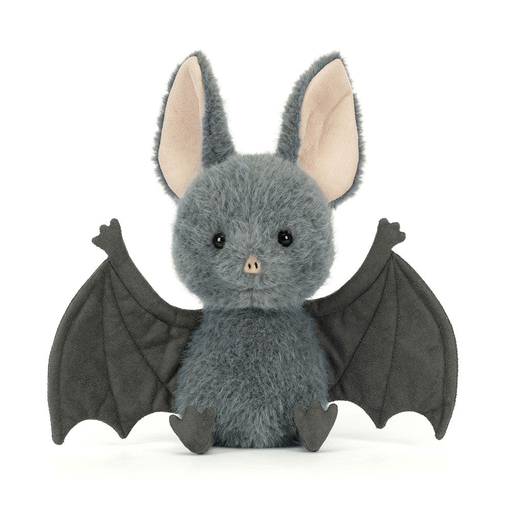 Plush toy bat with gray body and black wings on a white background.