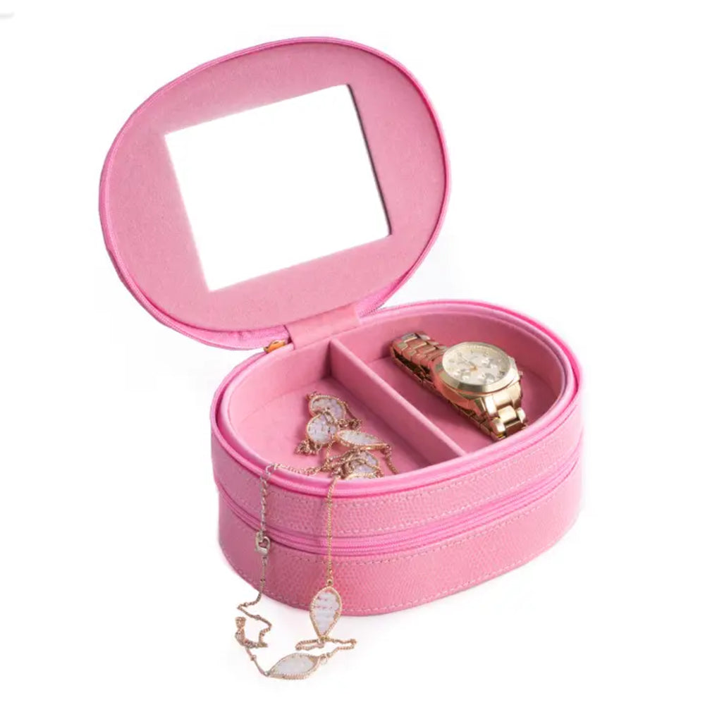 Pink jewelry box with a mirror lid, containing a watch and jewelry items on a white background.