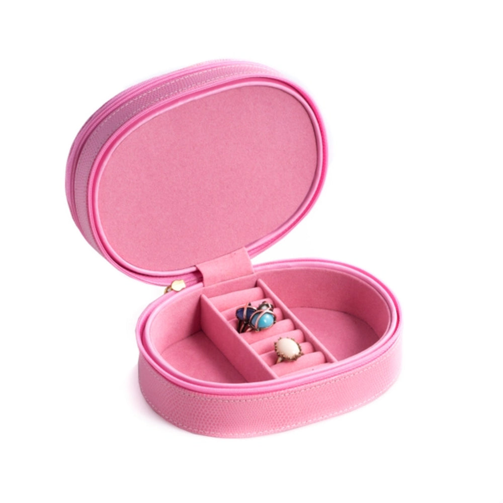 Pink jewelry box with a ring inside on a white background